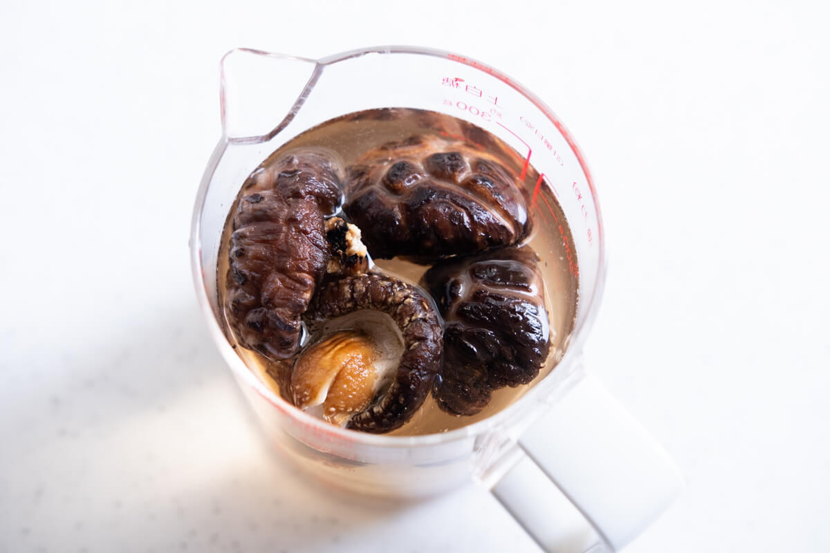 Shiitake mushrooms soaking in the warm water. 