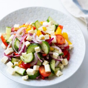 Greek salad made from cucumber, bell peppers, and cherry tomatoes.