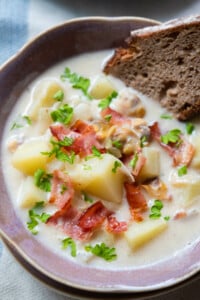 Creamy potato clam chowder served with sourdough bread.