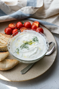 Classic tzatziki sauce served with cherry tomatoes and pita bread.