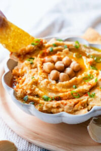 Hummus dip with corn chips.