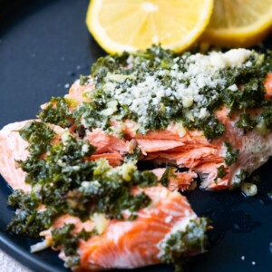 Cut the middle of garlic parmesan salmon to show the tender fish meat.