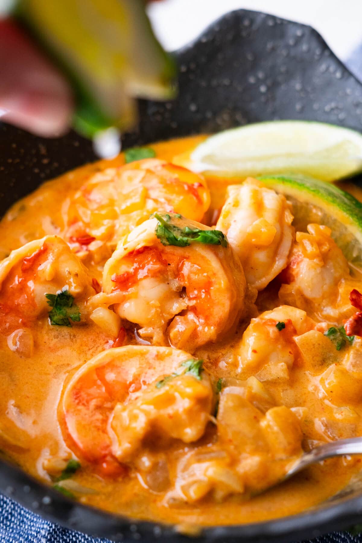 A bowl of coconut chili shrimp, ready to serve. 