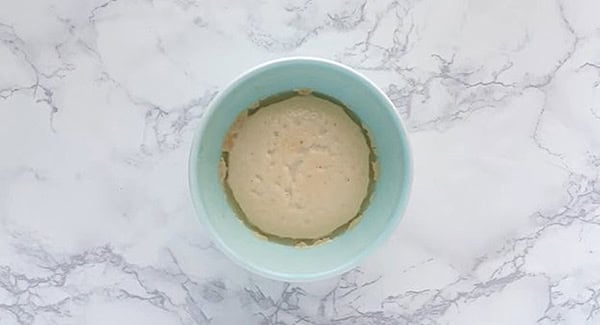 Foamy yeasts in a bowl, ready to activate the naan dough. 