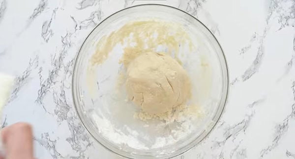 Homemade dumpling wrapper dough in a bowl.