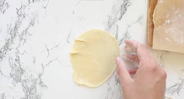 Homemade Dumpling Wrappers being rolled out.