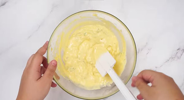 Butter mixed with garlic and herb to make garlic herb butter. 