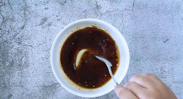 Mixing soy sauce glaze for salmon.