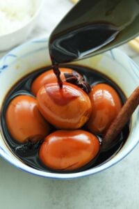 Delicious braised eggs in soy sauce in a bowl.