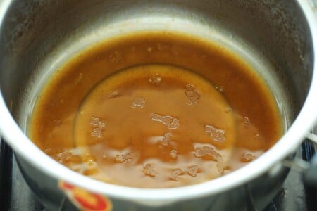 Making Chinese greens oyster sauce mixture in a sauce pan. 