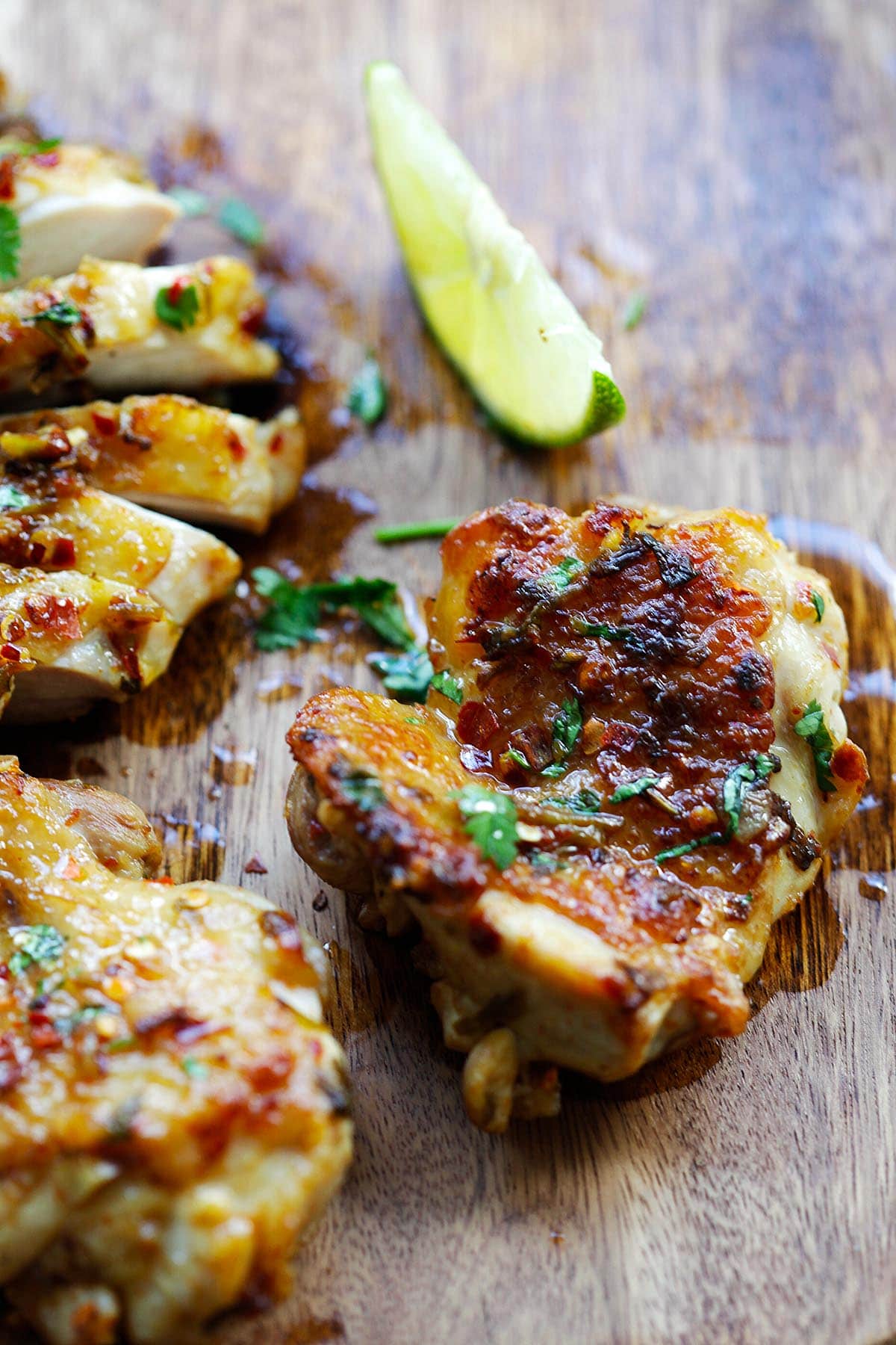 Chicken with cilantro lime on a cutting board. 