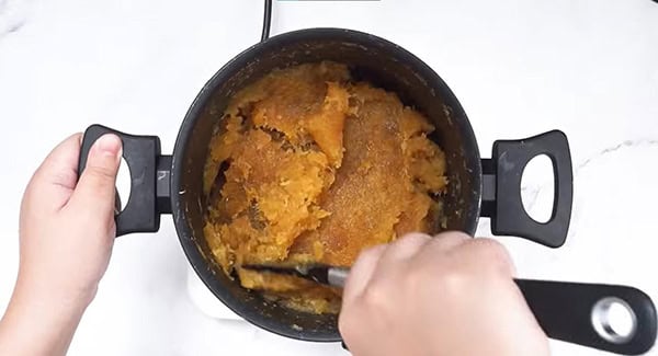 Pineapple cookie filling in a pot. 