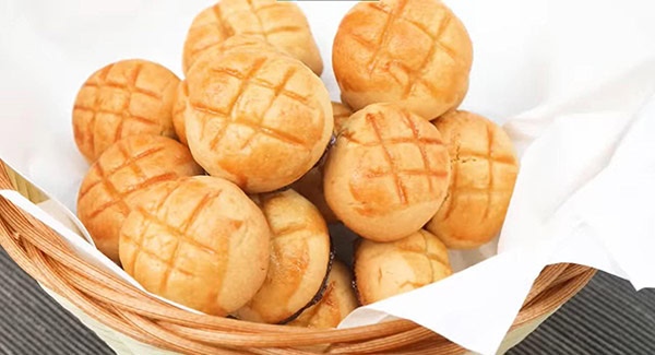 Cooled pineapple cookies served in a basket.