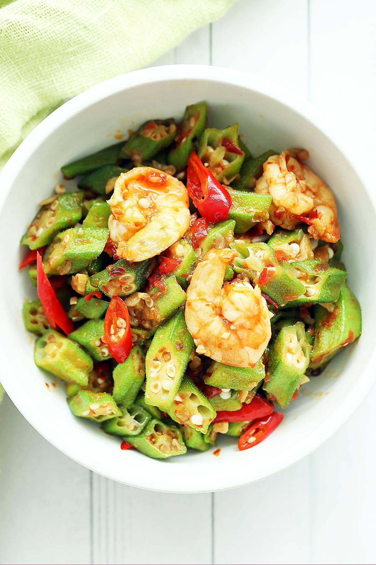 Lady fingers okra with shrimp and sliced red chilies. 