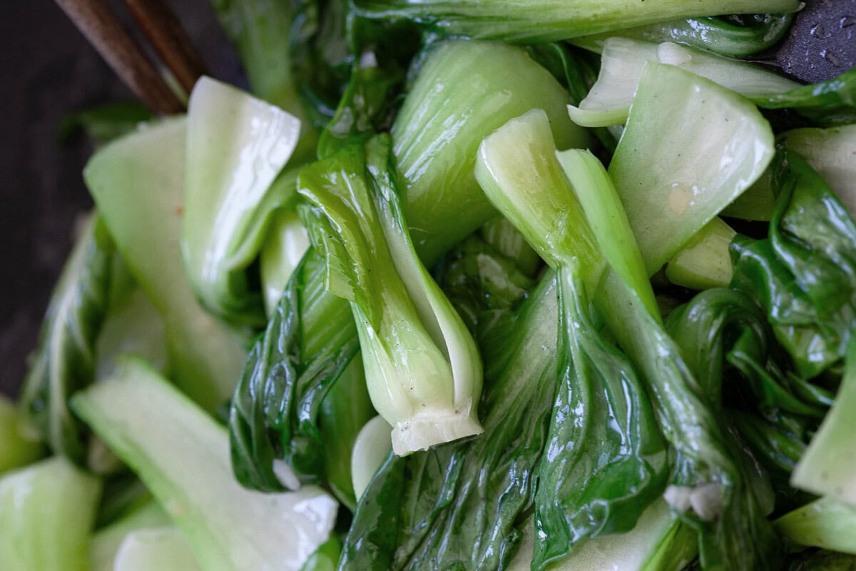 Stir fry garlic bok choy in a skillet. 