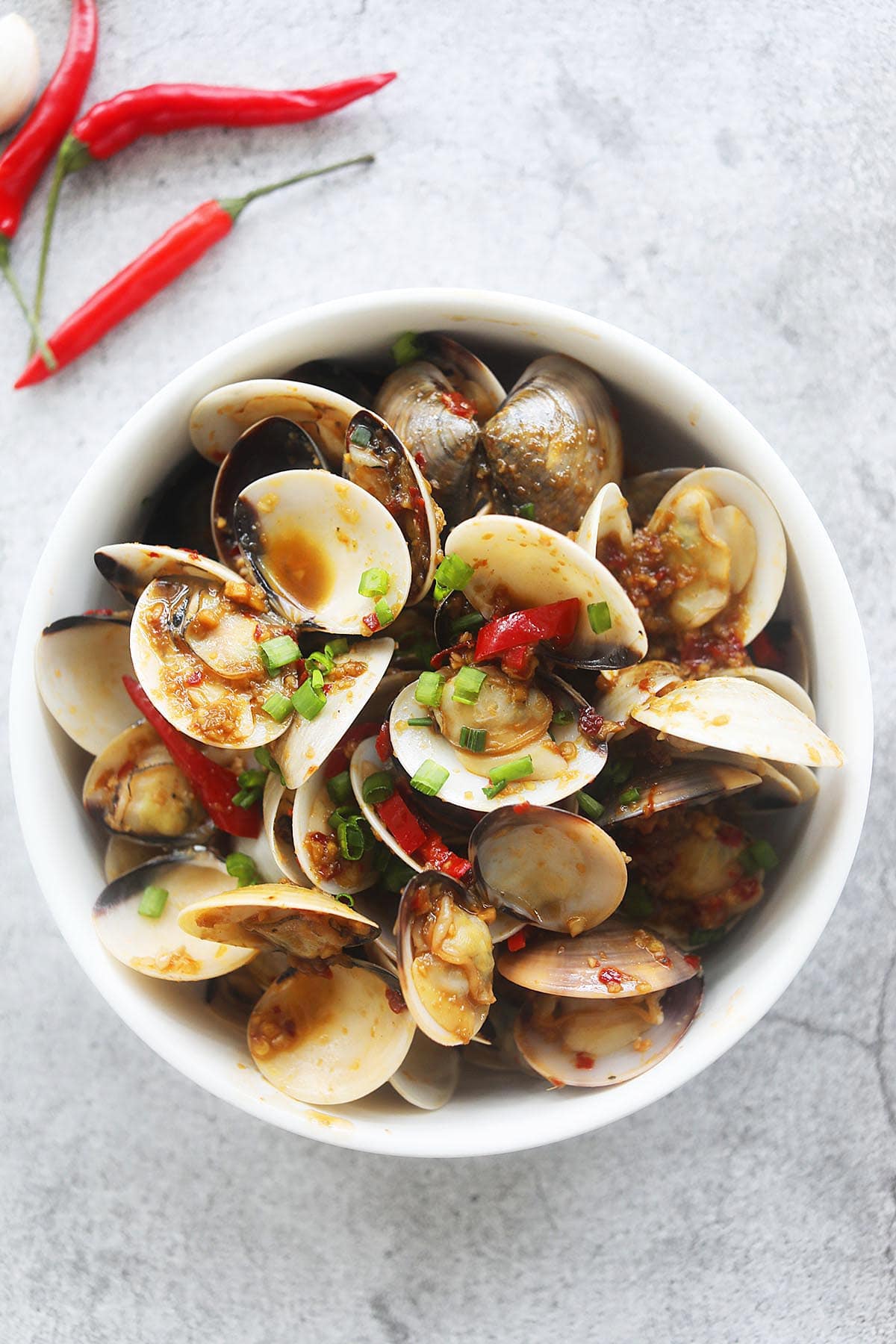 Chinese spicy clams with chilies in a bowl. 