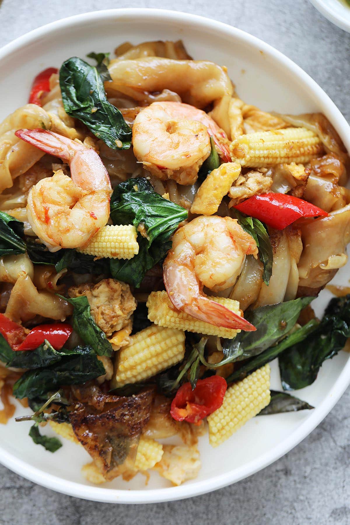 Authentic drunken noodles with shrimp, basil and vegetables. 