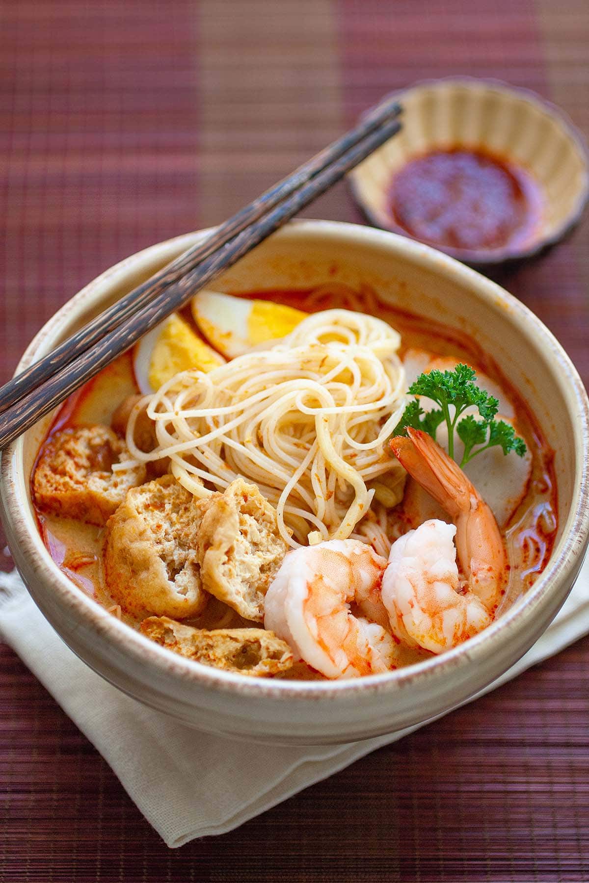 Red curry noodle soup with rice noodles. 