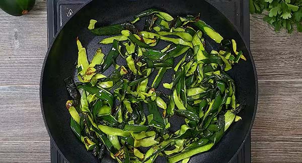 Stir fry the zucchini skin in a skillet. 