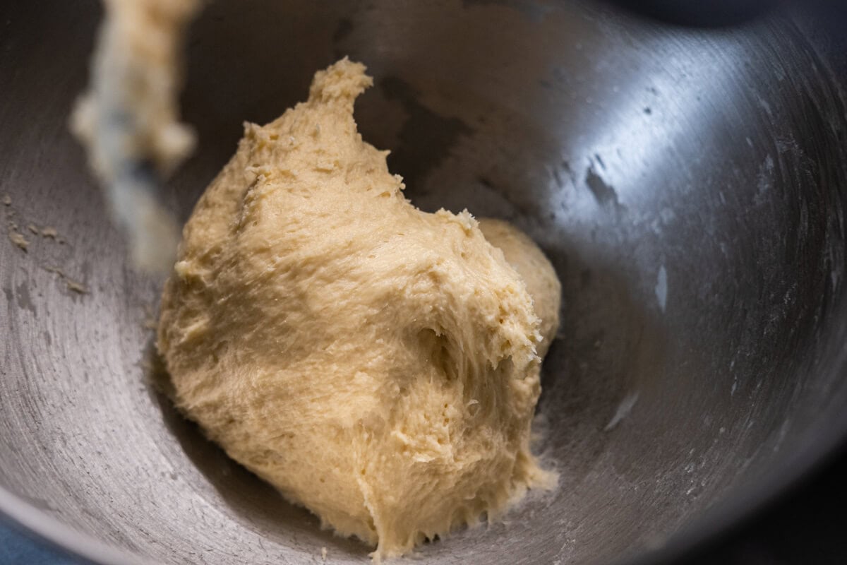 Mix the flour, sugar, salt, milk powder, and yeast until combined, then add the water and egg to the flour mixture in a stand mixer. 