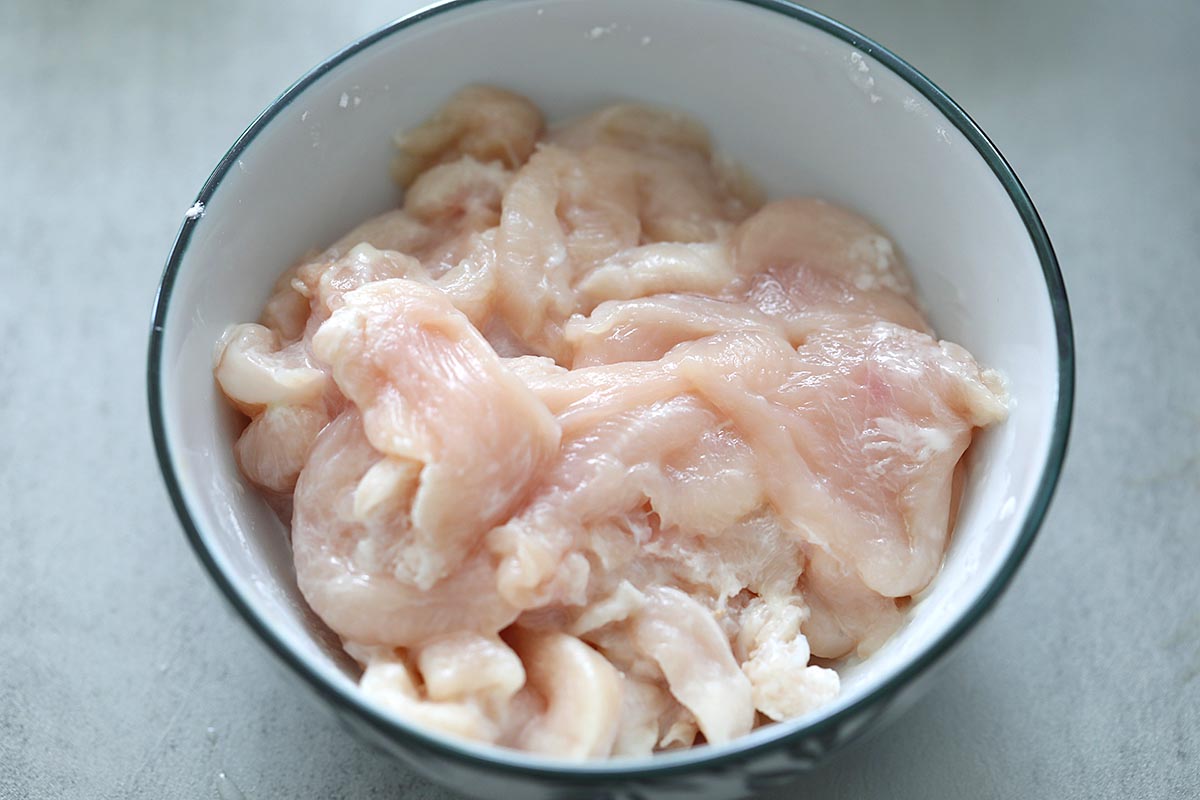 Sliced chicken breast in a bowl.