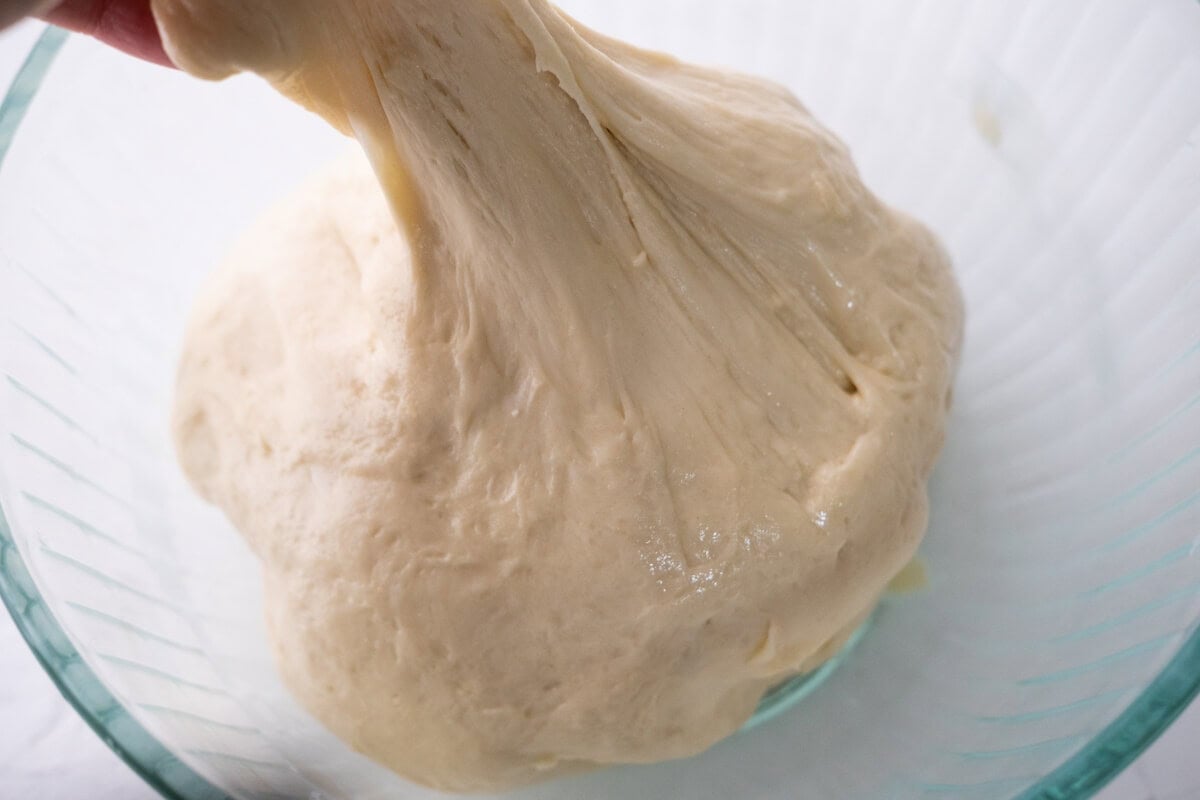 Combine all dry and wet ingredients for the dough and knead it until shiny and elastic. 