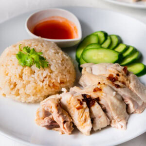 Homemade Hainanese chicken rice on a plate.