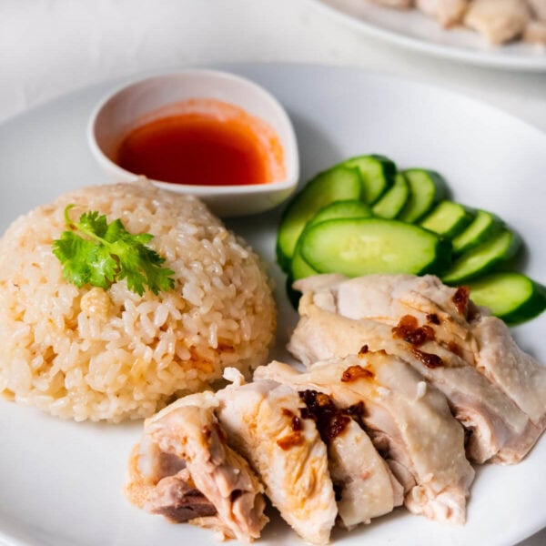 Hainan chicken rice served with cucumber and Hainan chicken.