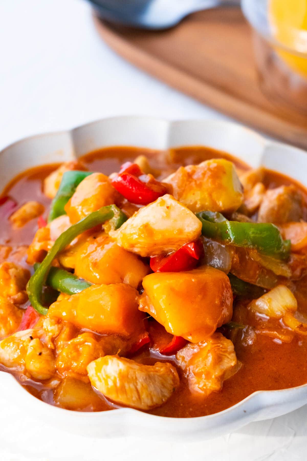 Easy delicious Malaysian mango chicken in a bowl.