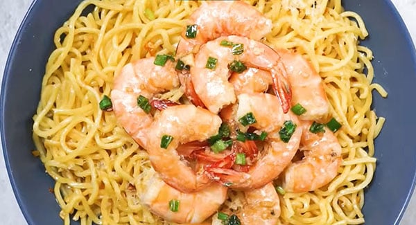 Shrimp garlic noodles served on a plate.